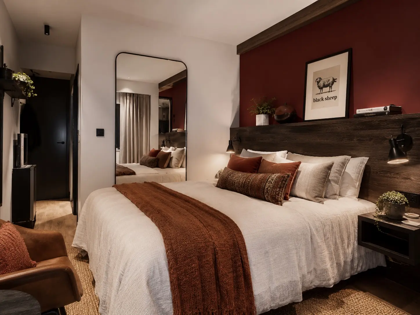 Rosso design visual with a deep clay headboard wall, smoked oak joinery and warm neutral textiles